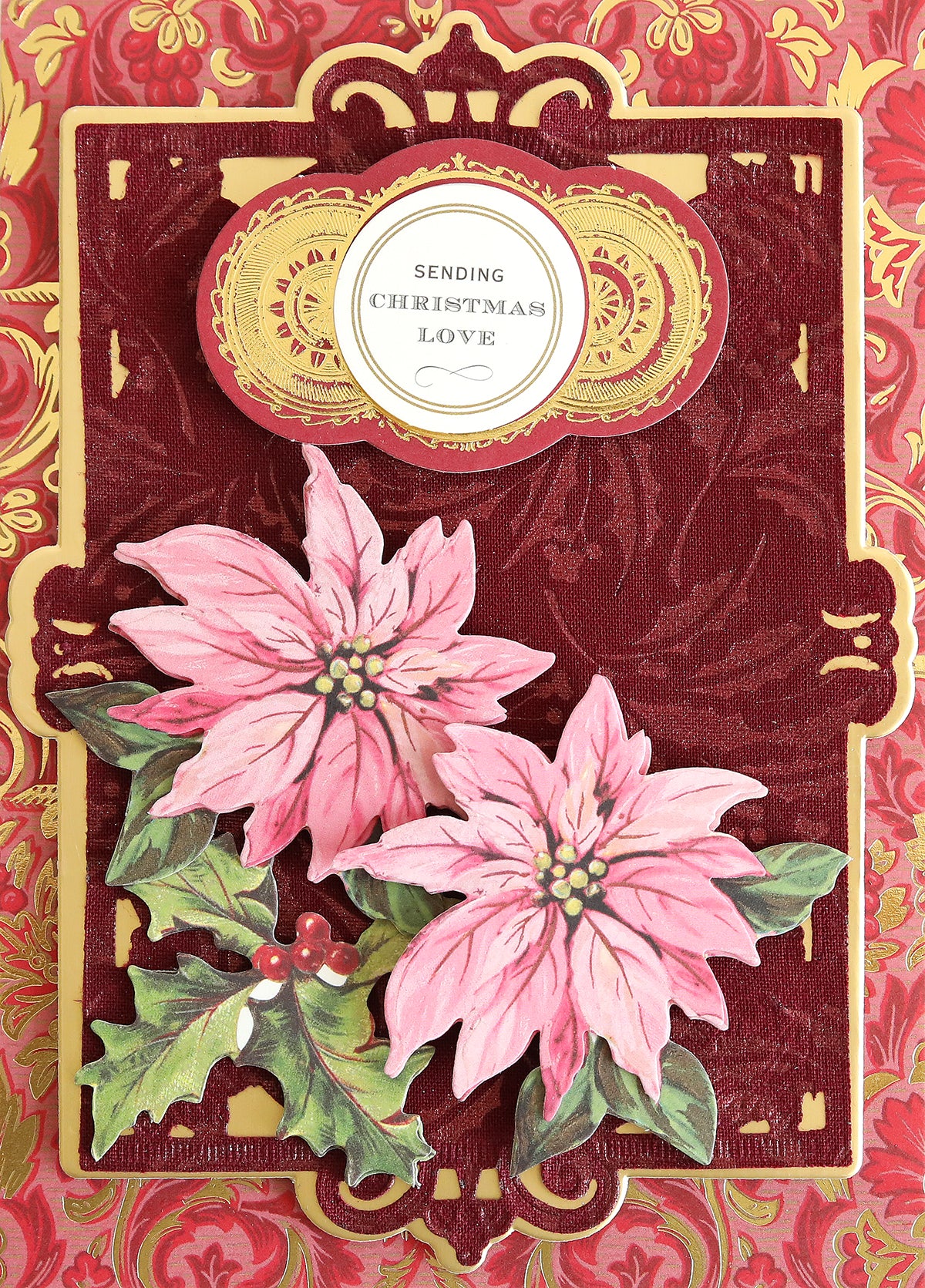 Holiday Fabric Card Layers featuring pink poinsettias, holly, and an ornate gold and burgundy background, beautifully crafted on fabric cardstock. Perfect for Christmas card making or enhancing your seasonal greetings. The top reads: "Sending Christmas Love.