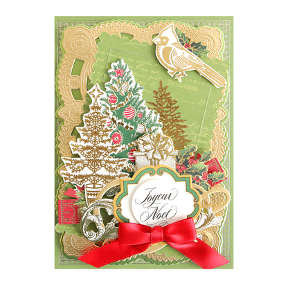 The Holiday Foil Rub On Transfers feature trees, a cardinal, ornaments, gold accents, a red bow, and "Joyeux Noël" in elegant script for a festive decorative Christmas card.