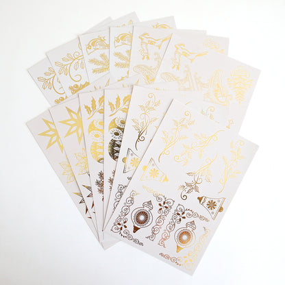 Holiday Foil Rub On Transfers feature metallic gold and bronze floral and ornamental designs in a fan shape on white—ideal for adding shimmer to your crafts.