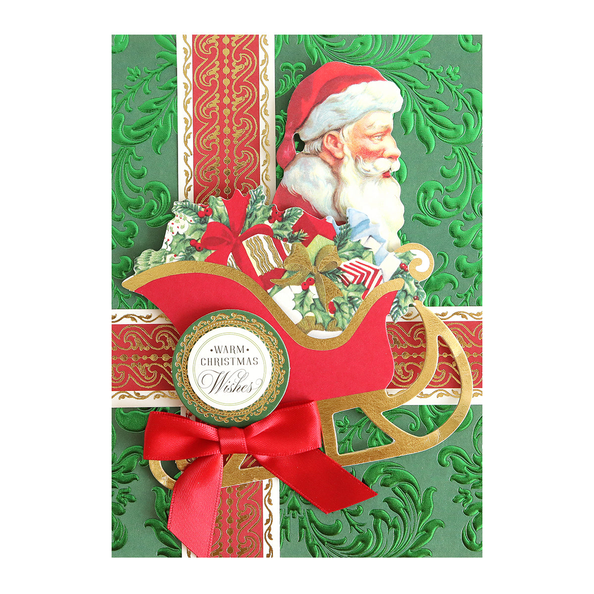 The Luxury Holiday Tonal Foil Cardstock features a green foil-embossed finish, red and gold ribbon, and Santa in a sleigh with gifts. Ideal for card making or scrapbooking. "Warm Christmas Wishes" is printed on the sleigh.