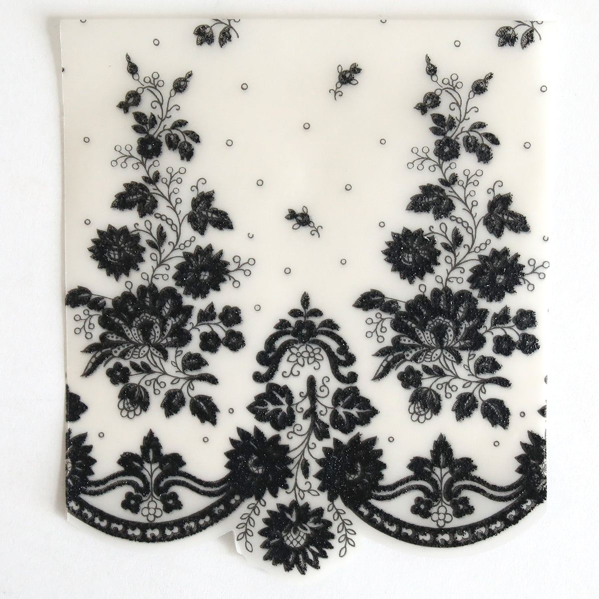 The Black Lace Petticoat Vellum Wrap 10 pack features sheer white rectangular sheets with ornate black floral lace and scalloped edging, ideal for elegant wedding invitations or sophisticated invitation wraps.