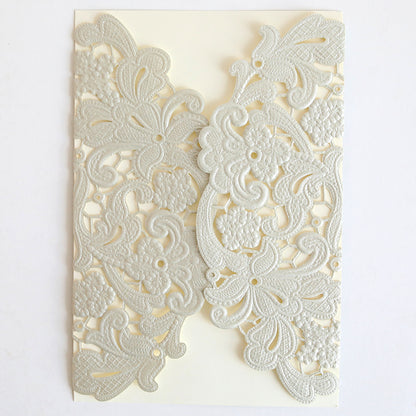 The Silver Embossed Lace Gatefold 10 pack features cream-colored wedding invitations with intricate floral and paisley lace designs, embossed gatefolds, and a subtle silver shimmer on a white background.