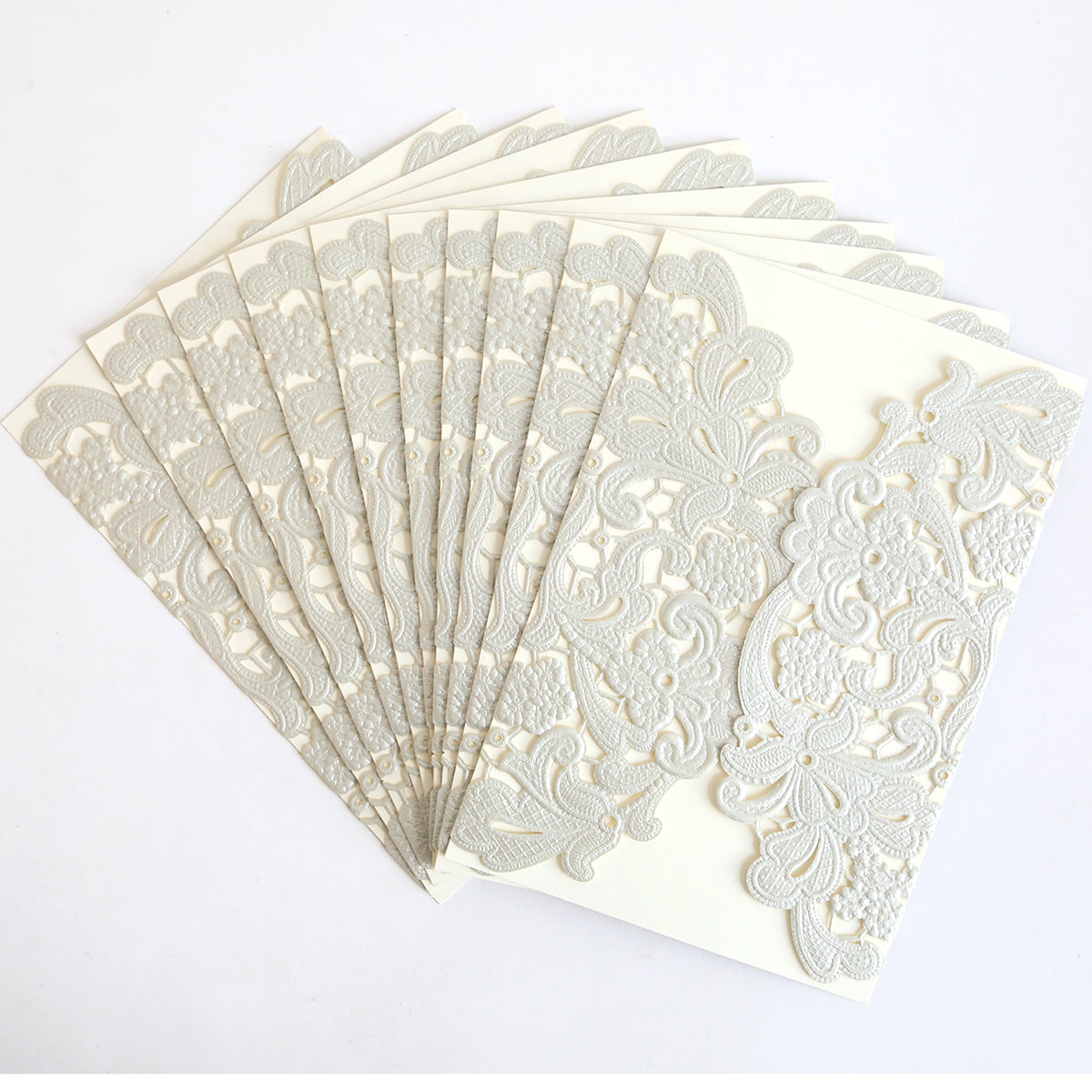 The Silver Embossed Lace Gatefold 10 pack features ornate cream wedding invitations with intricate embossed lace and a subtle silver shimmer, displayed fanned out on a white background.