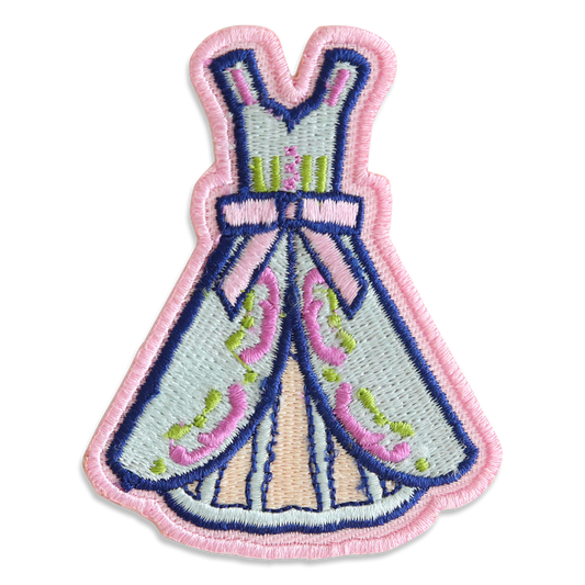 Exclusive embroidered Members Only Badge for July 2024 featuring a blue dress with pink and green floral accents and a pink border.