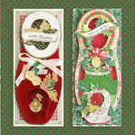 Two colorful Christmas-themed greeting cards surrounded by decorative elements on a green patterned surface. The left card reads "Merry Christmas" and the right card reads "Jingle All The Way.