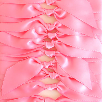 Add a touch of elegance to handmade cards or crafts with Pink Satin Knots 10 count—rows of neatly tied, shiny double-faced satin bows arranged in a repeating pattern. Perfect for decor or as pre-tied ribbons.