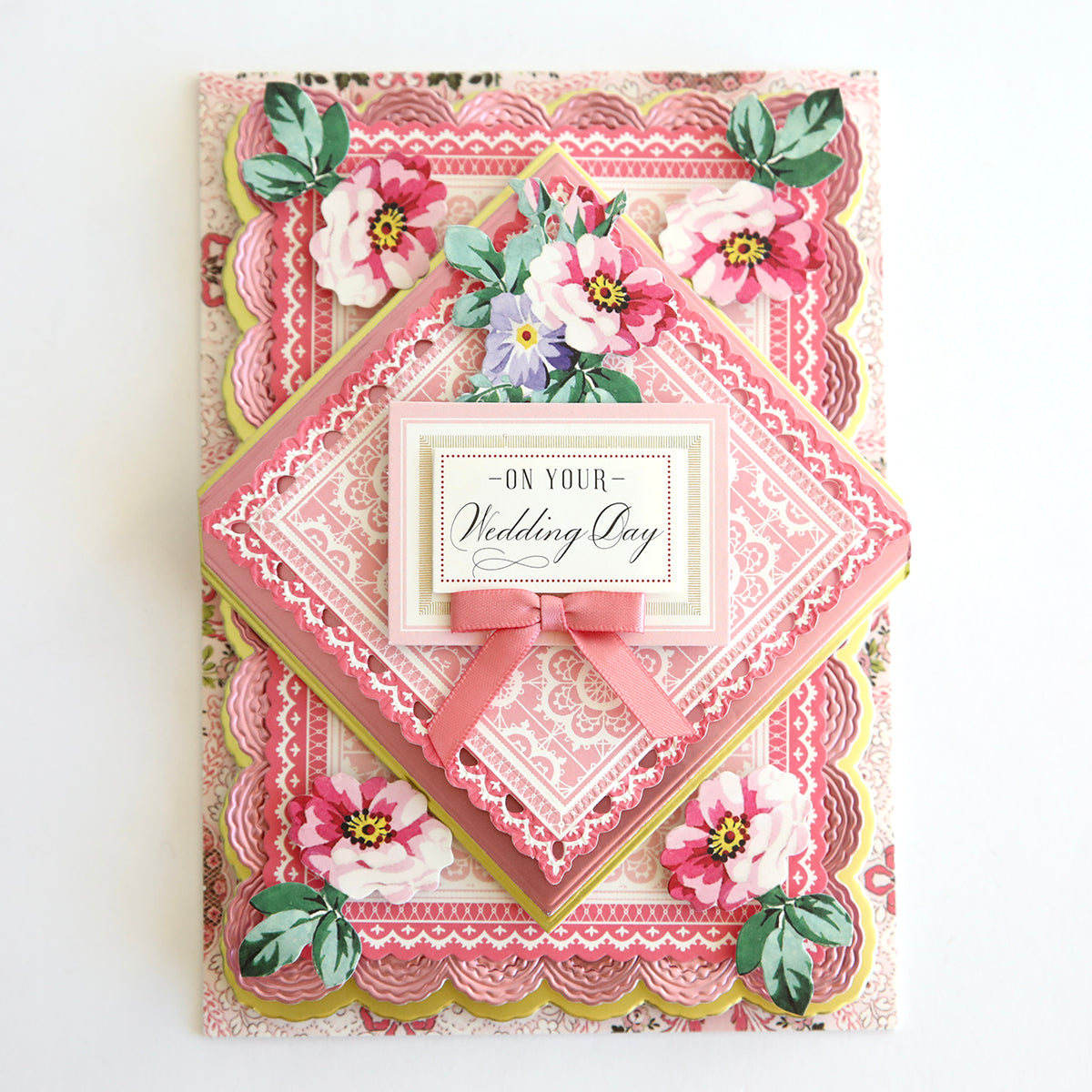 A vintage Valentine's card featuring pink and white flowers, ribbons, and Lace Doily Embellishments.