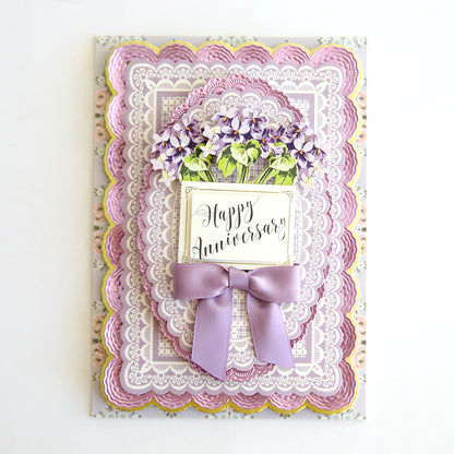 A dimensional anniversary card with Lace Doily Embellishments.