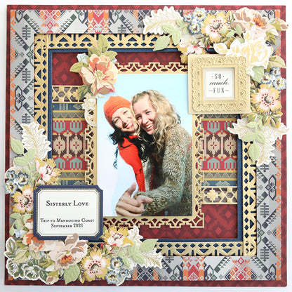 A decorative frame from our exclusive Lomasi Cardstock Collection features floral and Native American patterns, showcasing a photo of two people smiling and holding hands. Text reads "Sisterly Love," "Trip to Mendocino Coast September 2021," and "So much FUN.