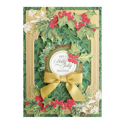 The Luxury Christmas Present Foil Cardstock is a decorative card featuring holly leaves, red berries, a gold bow, and an elegant "Have a Holly Jolly Christmas" message on premium cardstock.