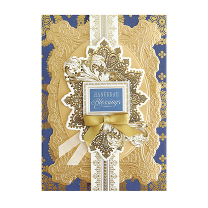 The Luxury Luster Foil Cardstock Hanukkah card features gold embossed patterns, a ribbon, and a “Hanukkah Blessings” label on an elegant blue and gold background—ideal for holiday crafts and festive greetings.