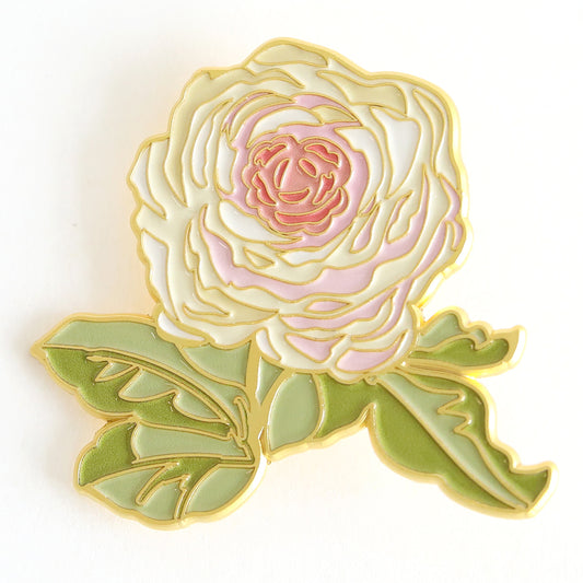 The Members Only May Pin features a white and pink rose with green leaves, outlined in gold. Part of our Exclusive Pins collection—perfect for 2025 Members Only Livestreams.