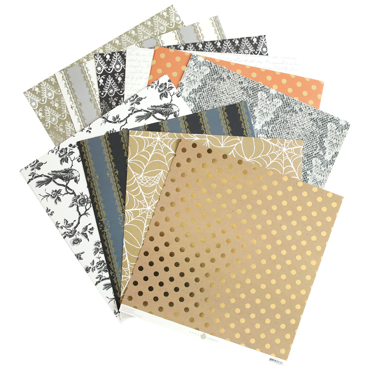 The Mystery Halloween 12x12 Cardstock set includes decorative sheets with floral, lace, polka dot, and spider web patterns in neutral and gold tones—perfect for Halloween crafting.