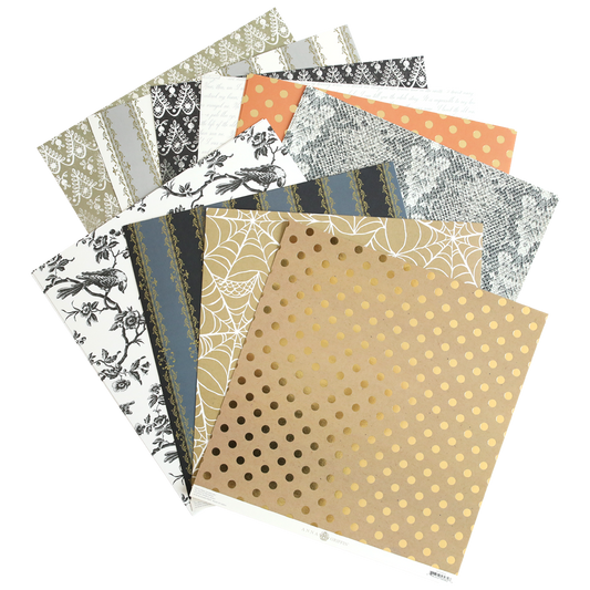 The Mystery Halloween 12x12 Cardstock set includes decorative sheets with floral, lace, polka dot, and spider web patterns in neutral and gold tones—perfect for Halloween crafting.