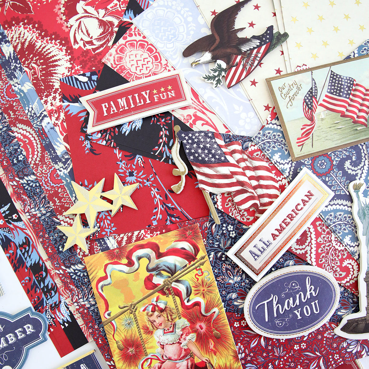 A vintage collection of patriotic papers and stickers, adorned with patriotic embellishments from the Madison Paper Crafting Collection.