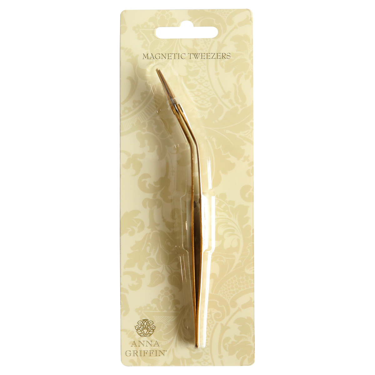 A gold plated Magnetic Tweezers in a package.