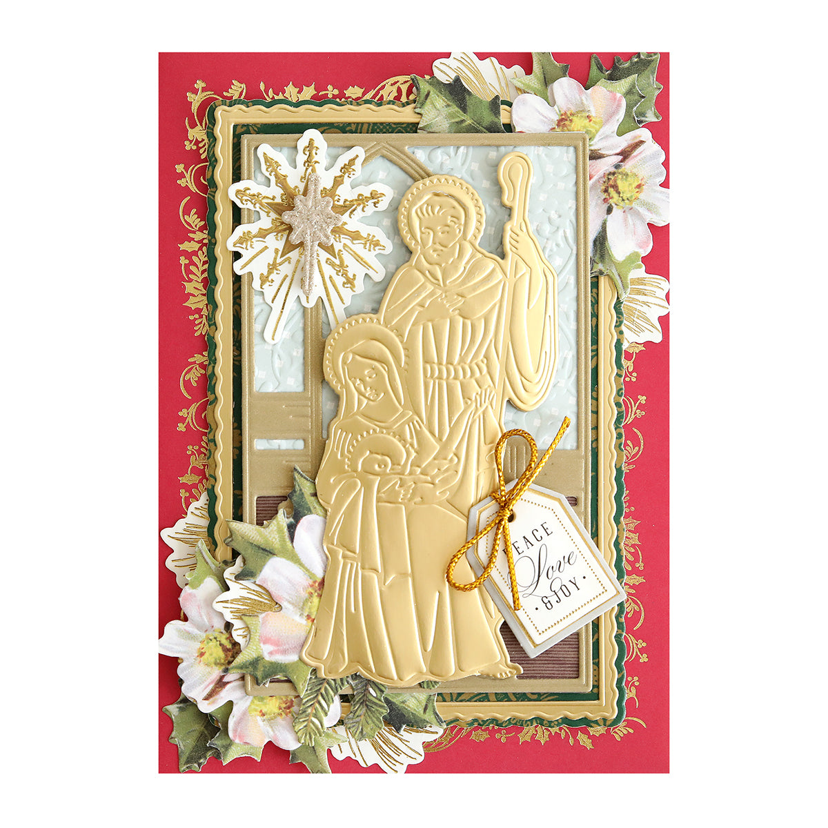 A decorative Christmas card made with the Mary and Joseph 3D Die Set showcases golden embossed nativity figures—Mary, Joseph, and baby Jesus—with floral accents and a "Peace Love & Joy" tag.