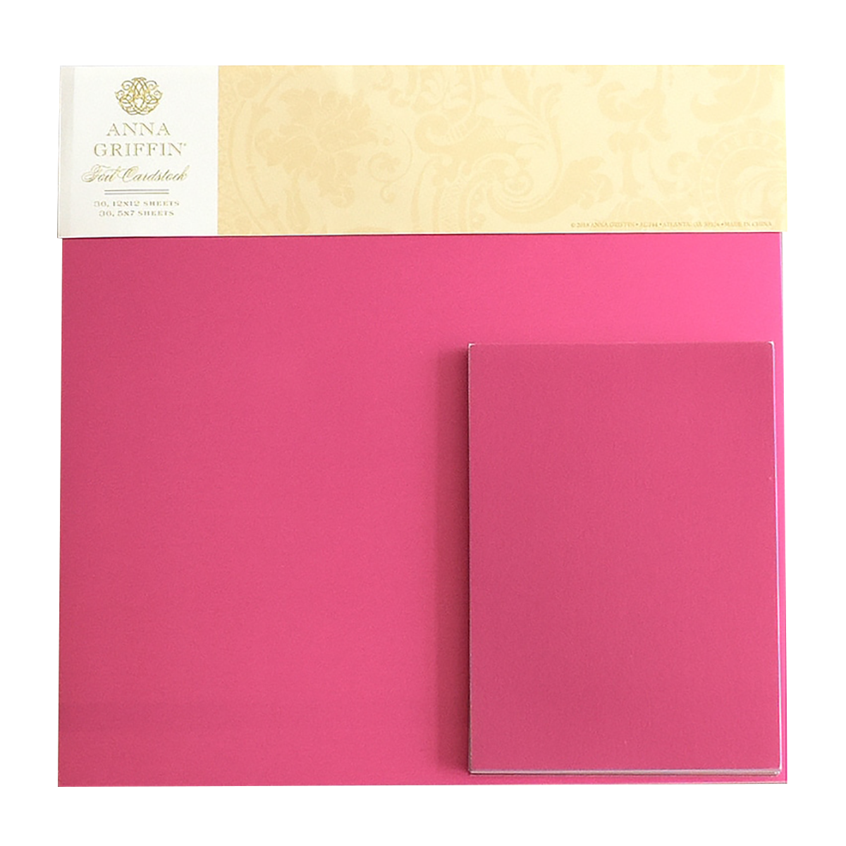 A pack of Foil Matte Cardstock - Raspberry, featuring 250gsm 12x12 bright pink foil sheets with a matching pink notecard placed on top.