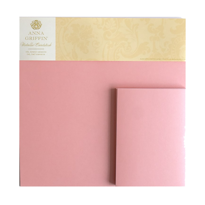 A bundle of Metallic Cardstock in Pearl Pink, 12x12 sheets, with a matching folded card displayed against a white background.