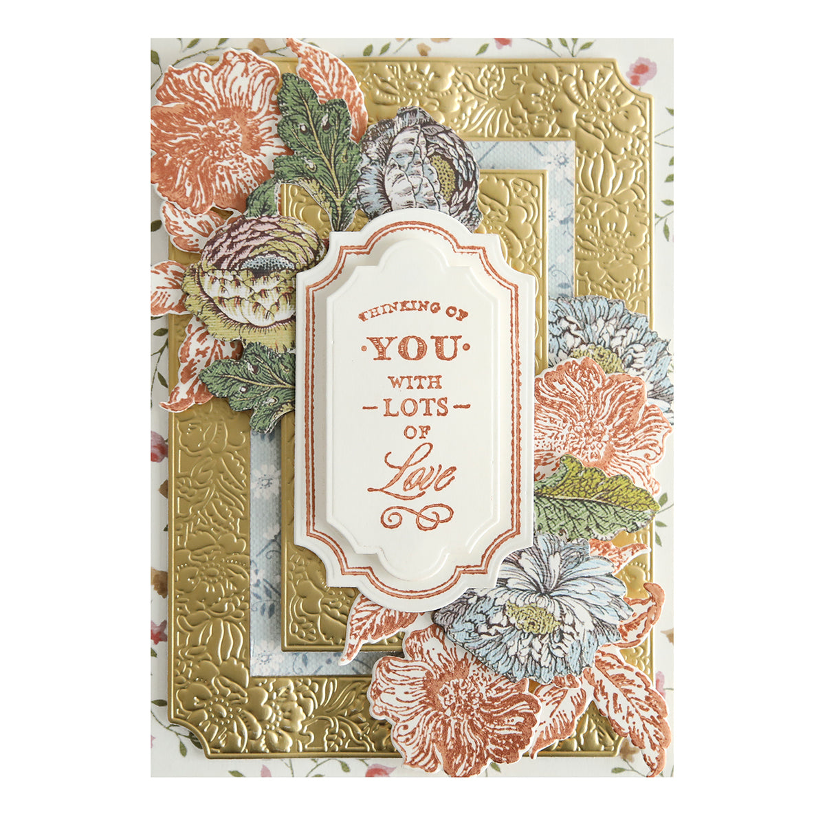 Handcrafted greeting card featuring floral designs and an embossed golden background with a central label stamped in Metallic Ink Pads with Stamp Cleaner, reading "Thinking of you with lots of love.