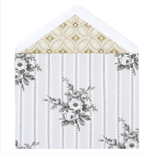 The Bouquet Stripe Note Cards feature an open lined envelope with a black-and-white floral pattern outside and a gold-and-white geometric pattern inside—perfect for pairing with folded or decorative cards.
