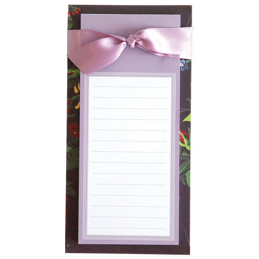 Astrid Floral List Pads note card with a pink ribbon detail on a tropical-themed background.