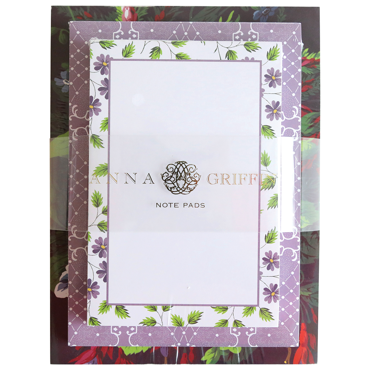 A decorative Astrid Note Pad Set package with 300 sheets on a floral background.