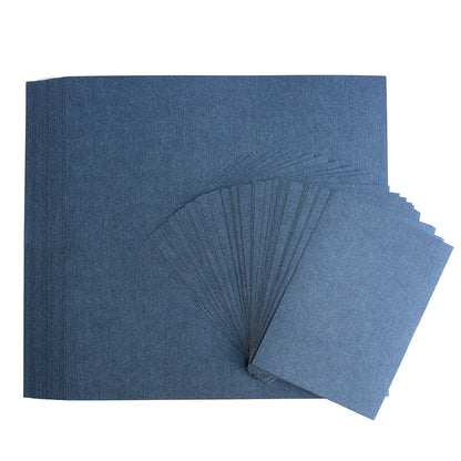 A pack of Anna Griffin Navy Metallic Cardstock on a white surface perfect for card making and die-cutting projects.