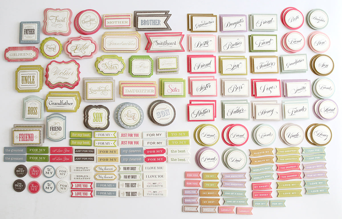 A collection of Nearest and Dearest Sticker Bundle tags and labels on a white surface.