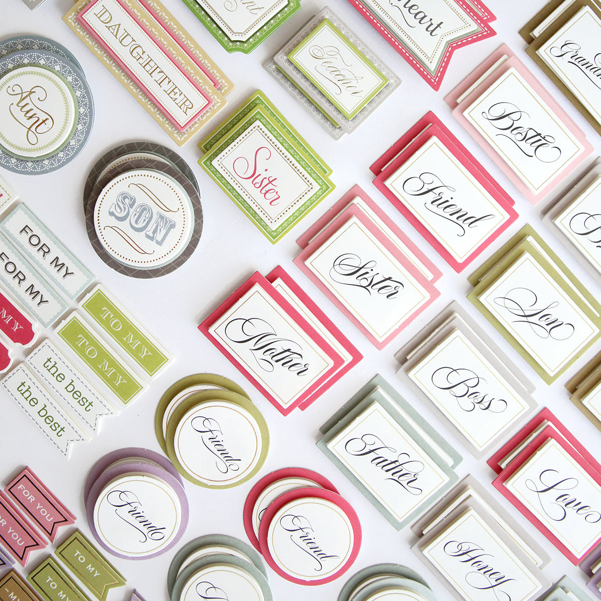 A collection of Nearest and Dearest Sticker Bundle stickers and labels on a white surface.
