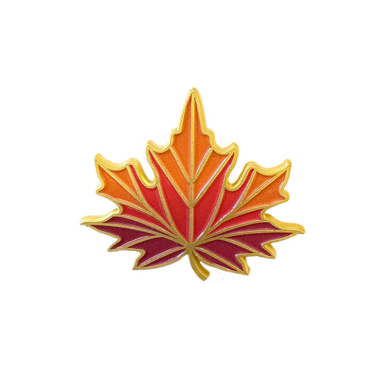 The Members Only November Pin is an enamel maple leaf with red, orange, and yellow hues outlined in gold—part of our 2025 Exclusive Pins collection.