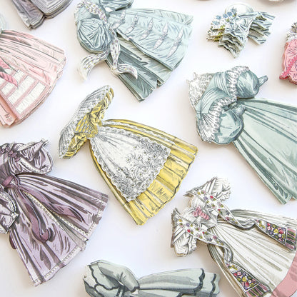 A dimension of Paper Fashion Stickers showcasing various fashion styles.