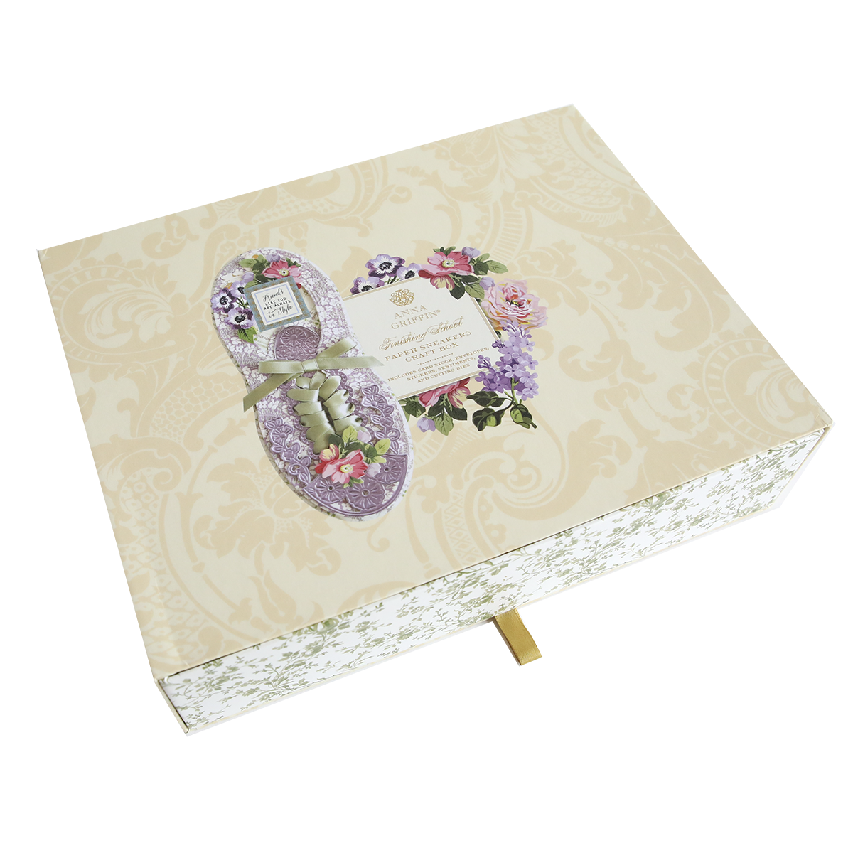 A floral-themed greeting card in the shape of Paper Sneakers on a patterned beige background with a gold ribbon, inspired by paper sneakers.