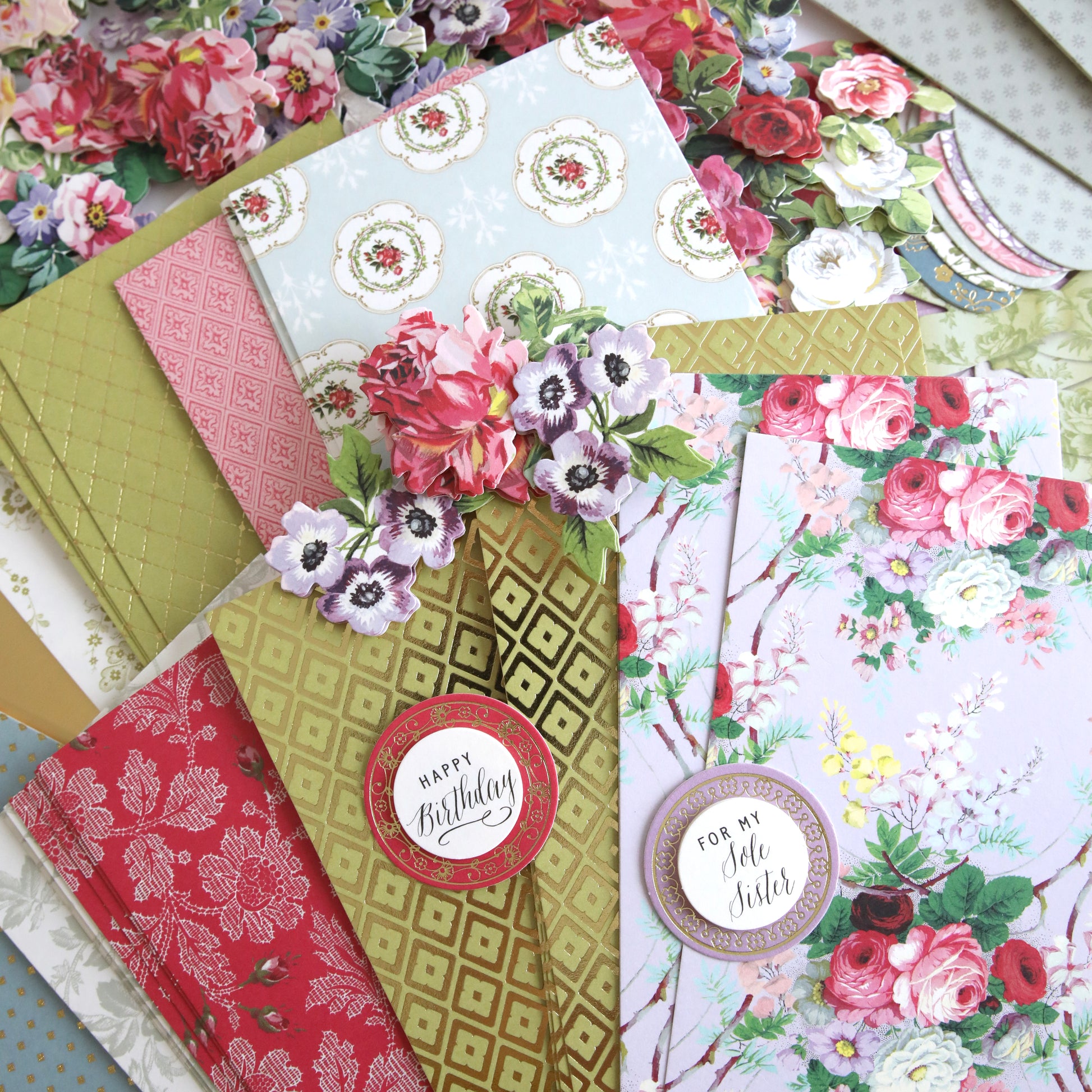 An assortment of floral greeting cards with various 2024 Finishing School Craft Box Autoship patterns and birthday wishes.