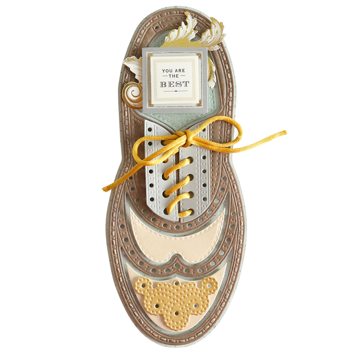 A Paper Wingtips Dies shaped like a detailed brown and beige paper wingtip shoe with a yellow lace, featuring the text "You are the Best!" on a small card at the top. Perfect for any shoe lover!