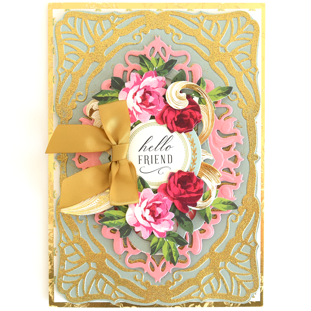 Greeting card made from Perfect Palette Flocked and Printed Cardstock, featuring gold embossed patterns, a gold ribbon bow, and pink and red flowers around a “hello FRIEND” circle. Ideal for cardmaking enthusiasts.