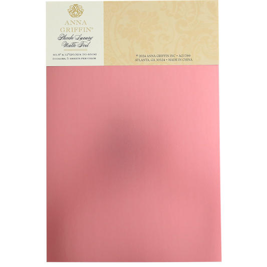 A package of Phoebe Luxury Matte Foil Cardstock 8x12 in pink, perfect for luxurious crafting projects, featuring the product's branding and details on the top part of the packaging.