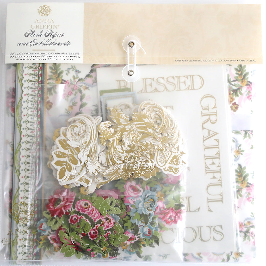 Introducing the Crop at Home 4 Scrapbook Collection: a craft kit complete with floral embellishments, ornate gold die cuts, and Diecut Titles sheets marked with "Blessed" and "Grateful," all neatly organized in a clear plastic pouch. Ideal for enhancing your cardstock projects or any Crop at Home event.