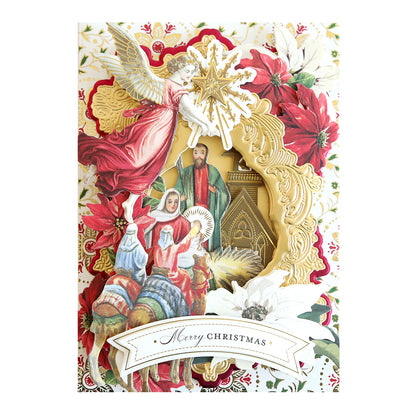 A vibrant Christmas card features an angel, the nativity scene with Mary, Joseph, and baby Jesus, surrounded by red poinsettias. The text "Merry Christmas" graces the bottom. It's perfect for your collection of Reason for the Season Embellishments or to pair with dimensional stickers in a storage folio.