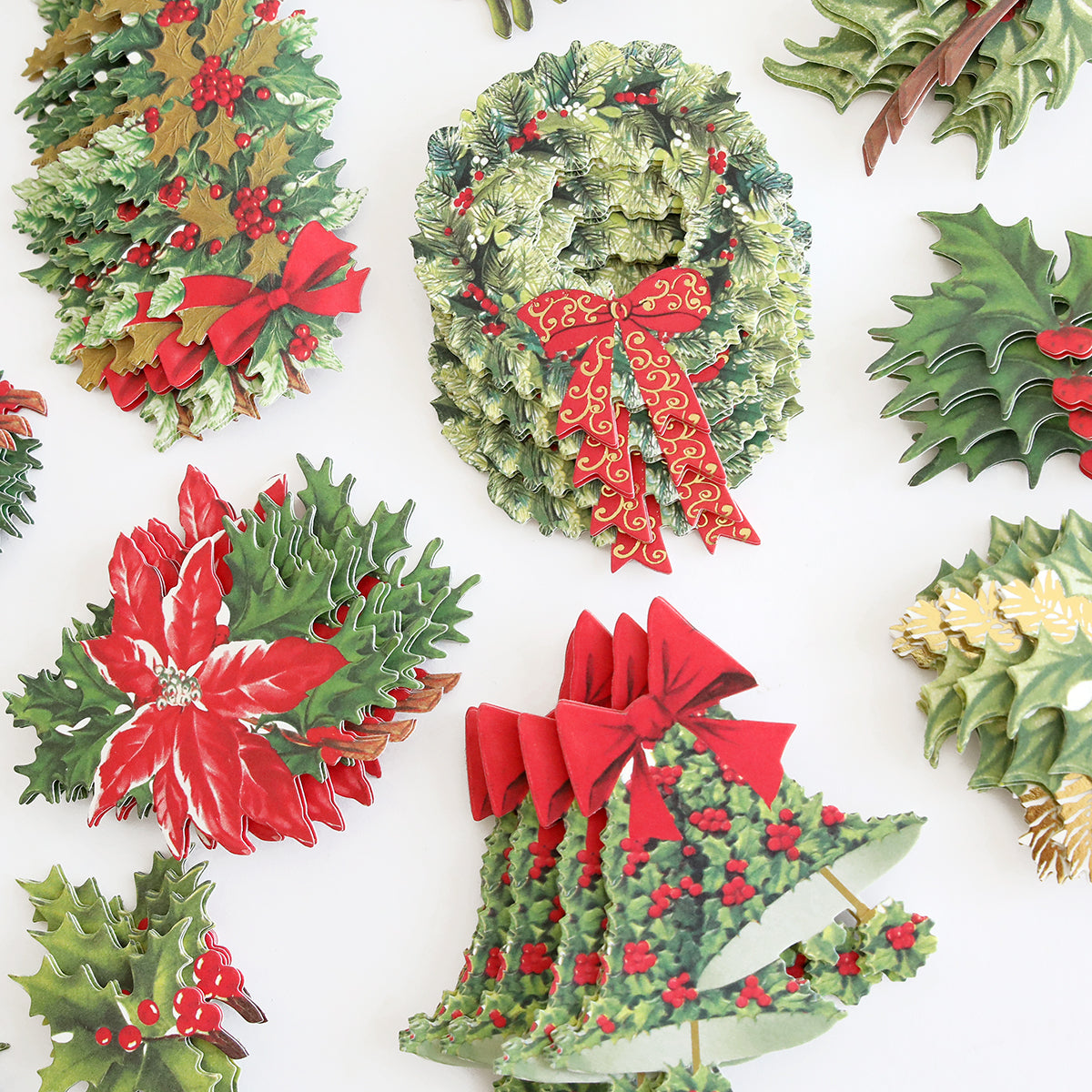Retro Holly Sticker Library, a seasonal craft project, is arranged on a white surface.