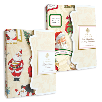 Two festive boxes of retro-themed Christmas cards featuring vintage Santa designs by Anna Griffin, each displaying messages such as "You Make My Holly Jolly" and "Merry Christmas." Every box includes 20 dimensional Christmas cards and envelopes, all neatly organized in a handy storage folio.