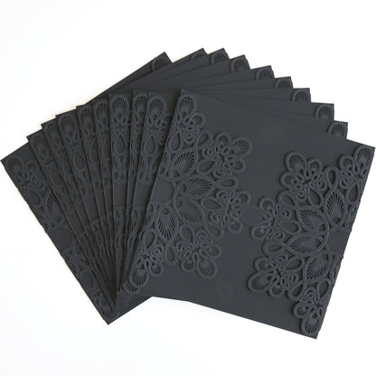 A pack of Black Triangle Lace Band cards, featuring intricate laser-cut patterns, ideal for custom or elegant wedding invitations, fanned out on a white surface.