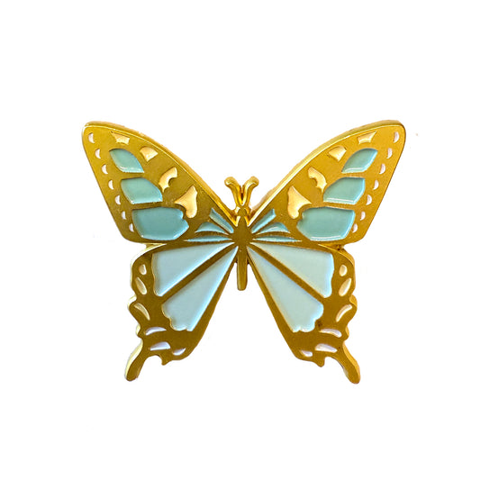 A gold butterfly brooch with light blue enamel wings, the Members Only September Pin is shown on a white background. Enjoy this 2025 exclusive—free with purchase and featured in special Members Only livestreams.