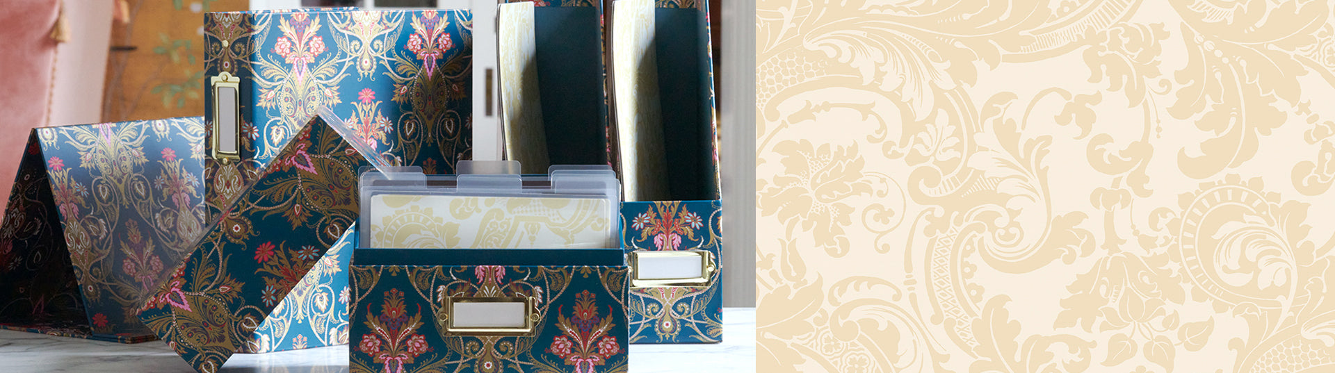 A floral-patterned box with a label holder sits open, revealing neatly organized index cards inside. The lid is propped open, and the background includes another similar box.