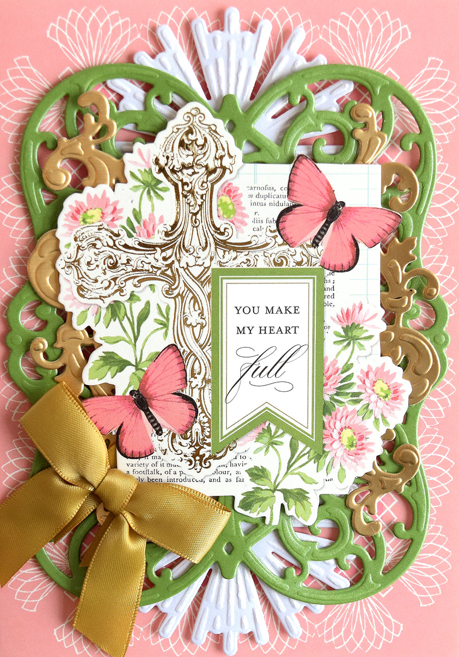 Add a touch of elegance to your Springtime Cards and Envelopes with this ornate foil-stamped card, featuring a gold bow, green and gold frame, cross, pink butterflies, floral background, and the heartfelt message: “You make my heart full”—perfect for your next card making project.