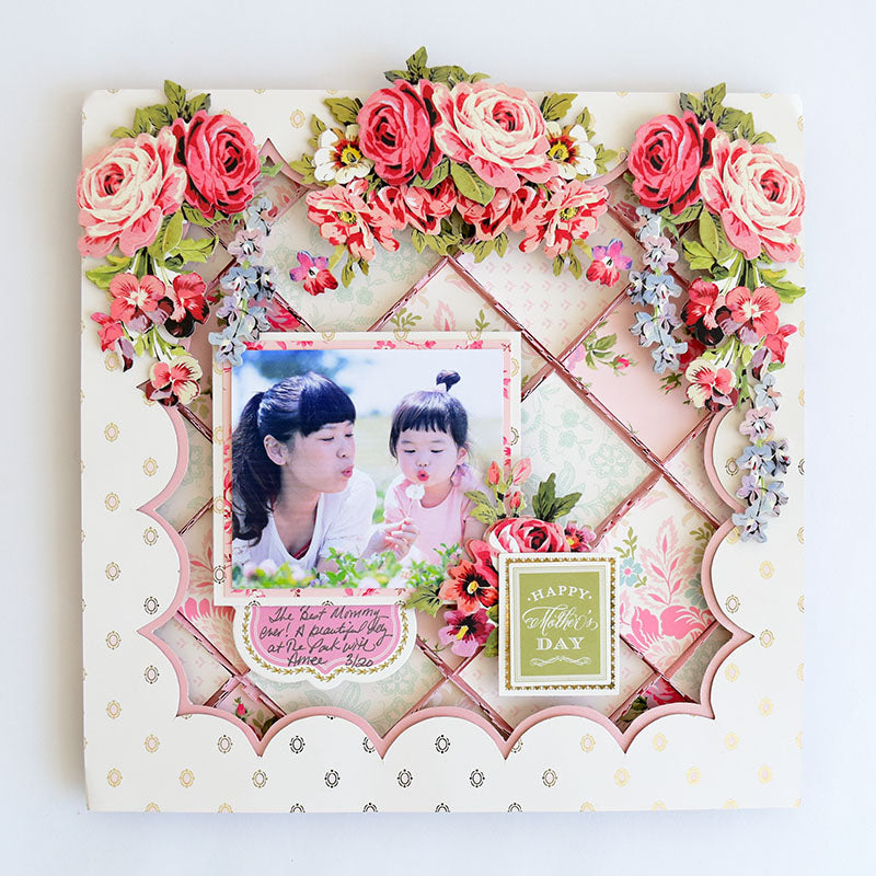Celebrate Mother’s Day with this elegant card, crafted from Tea Cup Double Sided 12x12 Card Stock and adorned with pink and red florals, a photo of a woman and child, and a heartfelt “Happy Mother’s Day” greeting.