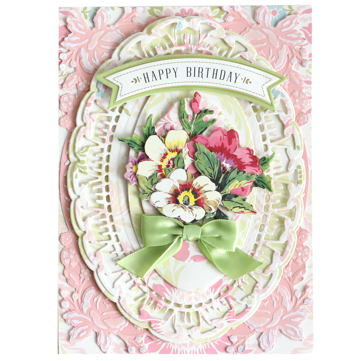 Layered "Happy Birthday" card crafted with Tea Cup Double Sided 12x12 Card Stock, featuring an ornate white frame, pastel pink background, and green ribbon bow beneath illustrated floral accents.