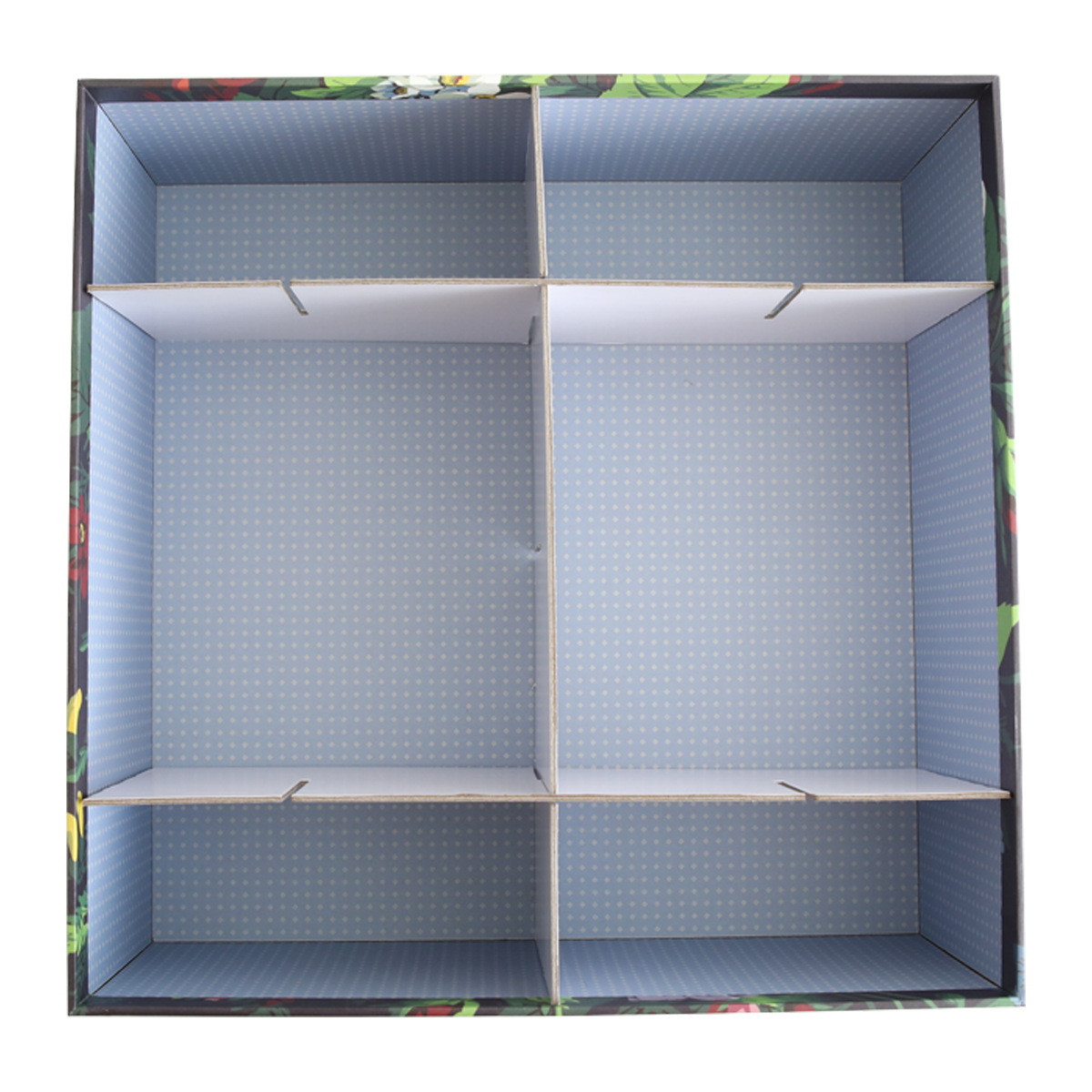 An empty cardboard box viewed from above with Create Storage Box Dividers creating four compartments to organize items.