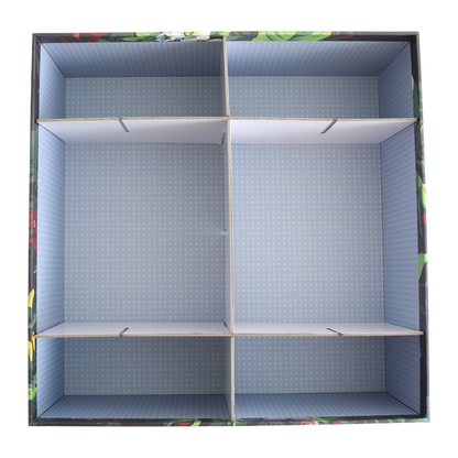 An empty cardboard box viewed from above with Create Storage Box Dividers creating four compartments to organize items.