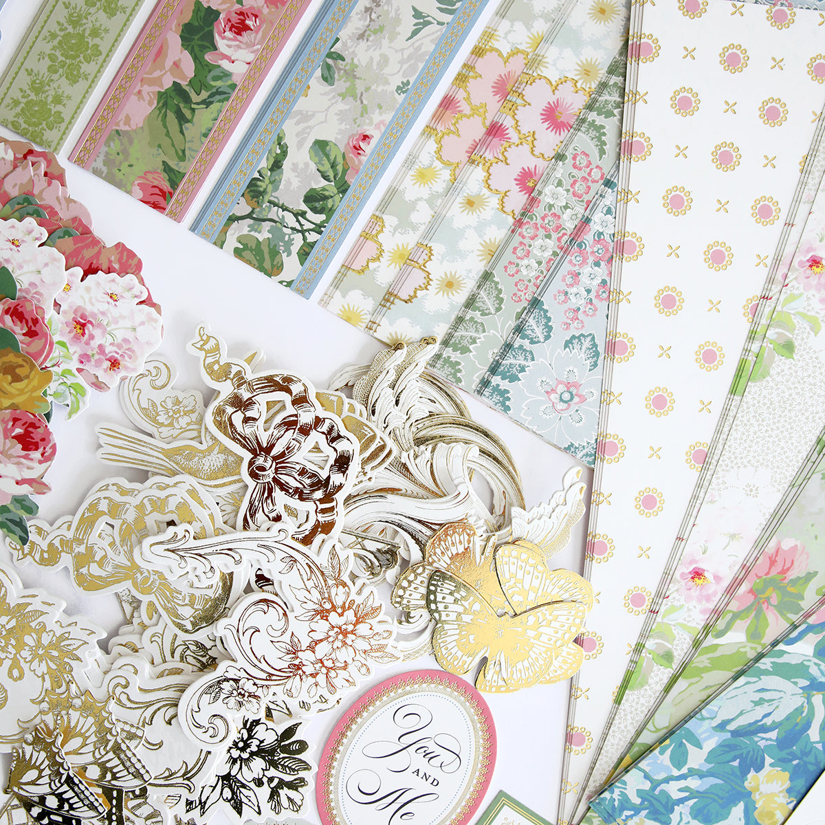 Various Virginia Papers and Embellishments are spread out in an overlapping arrangement.